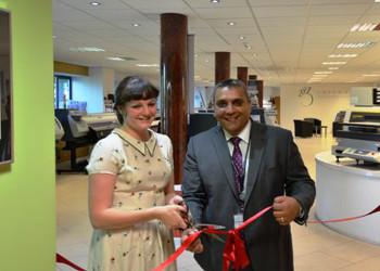 South Cheshire College Principal Jasbir Dhesi and student Megan Shepherd cut the ribbon on Hybrid's showroom 